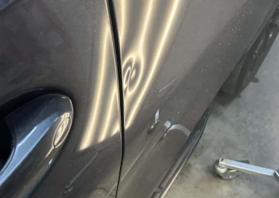 Before repair of a dent in a BMW door